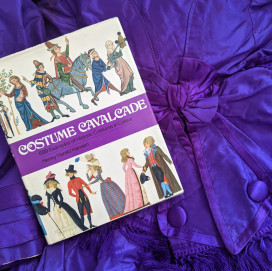 Costume Calvacade book on purple fabric